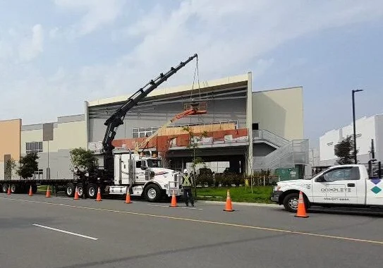 Professional engineers reviewing detailed traffic management plans for road construction.